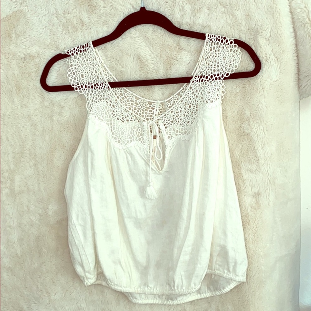 Sleeveless white blouse